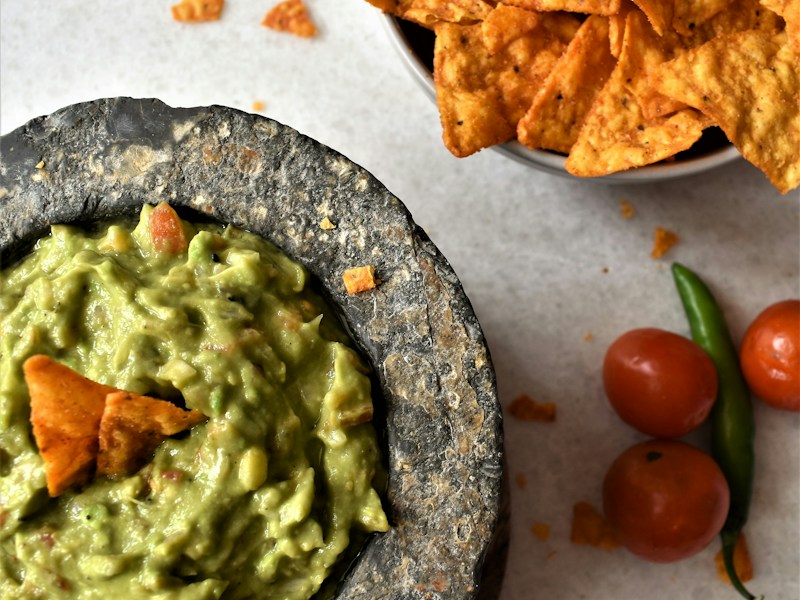 Ten-minute guacamole with tomato and cilantro.